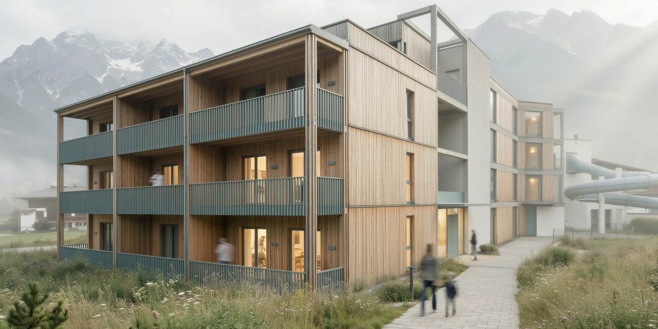 Aparthotel lebe’xams neben dem Schwimmbad Axams, im Hintergrund die Rutschenröhre